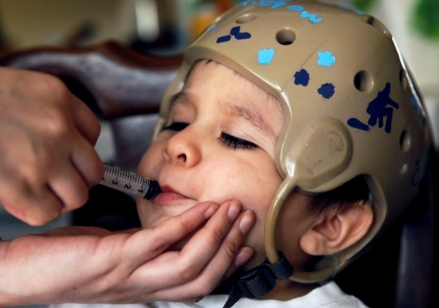 Child With Seizures Receiving Medicine