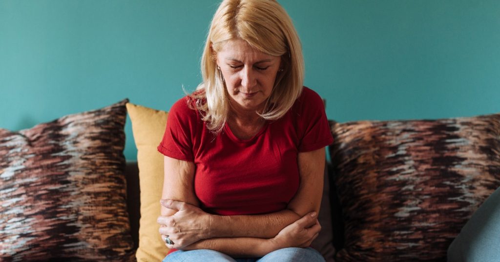 Mature Woman Experiencing Pain in Gut