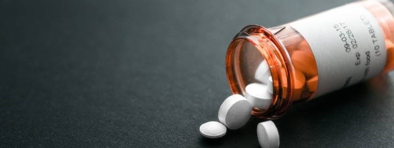 Pill Bottle Spilling Pharmaceuticals onto Countertop